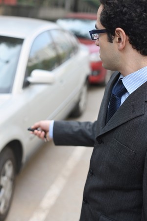 Businessman unlocking carの写真素材