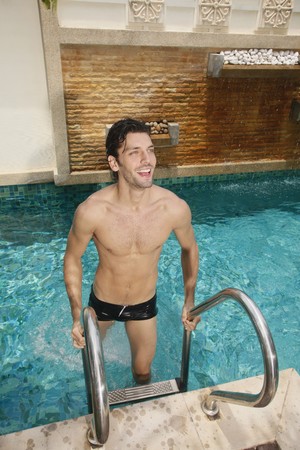 Man coming out from swimming pool