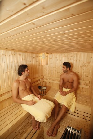 Men relaxing in saunaの写真素材