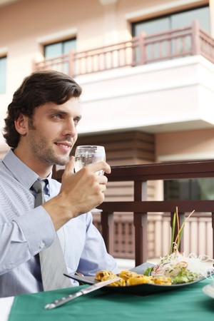 Businessman having lunch at a restaurantの写真素材