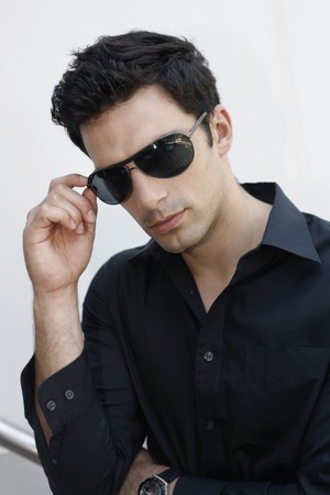 Man adjusting sunglassesの写真素材