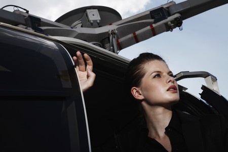 Businesswoman sitting in helicopterの写真素材