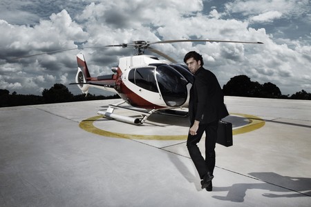 Businessman walking towards helicopterの写真素材