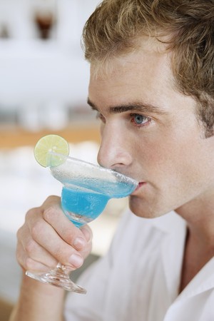 Man enjoying cocktail drinkの写真素材