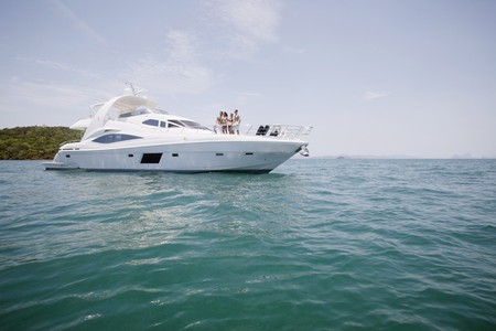 Couples relaxing on yachtの写真素材