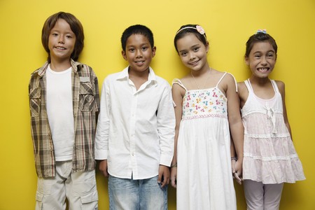 Boys and girls standing in a rowの写真素材