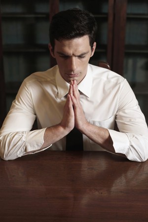 Businessman praying