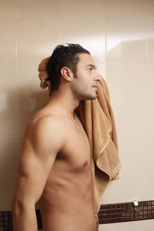 Man wiping body with towelの写真素材