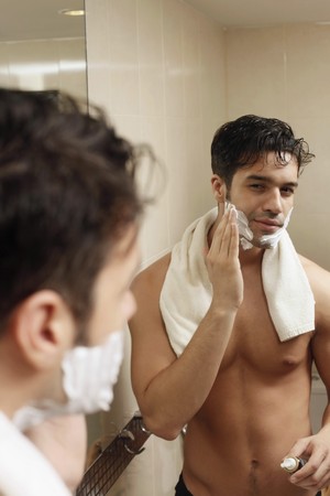 Man applying shaving creamの写真素材