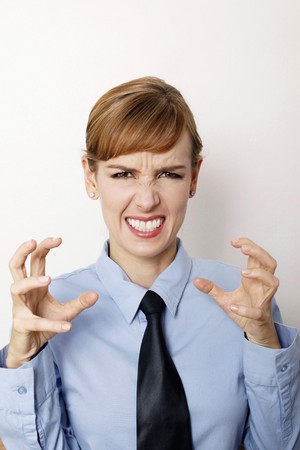 Angry businesswoman clenching her teethの写真素材