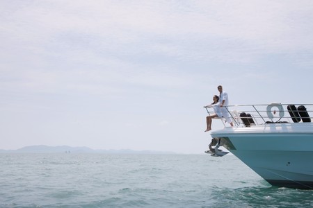 Couple relaxing on yachtの写真素材