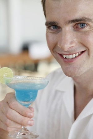 Man enjoying cocktail drinkの写真素材
