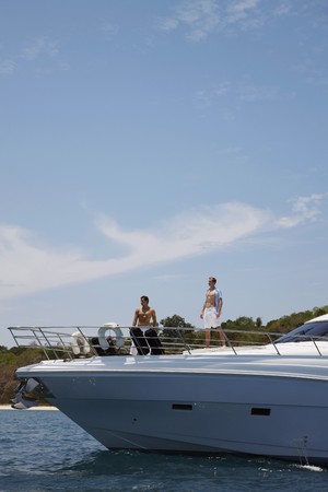 Men standing on yachtの写真素材