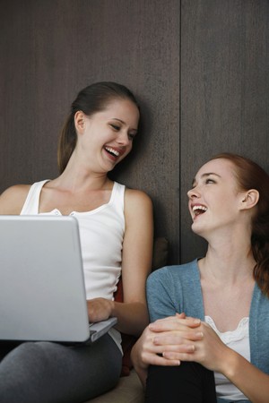 Women laughing togetherの写真素材