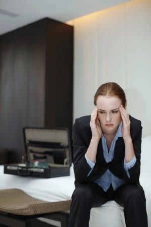 Businesswoman massaging her templesの写真素材