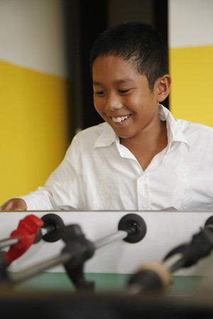  Boy playing table footballの写真素材