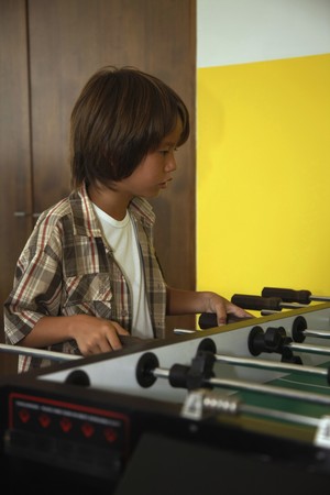  Boy playing table footballの写真素材