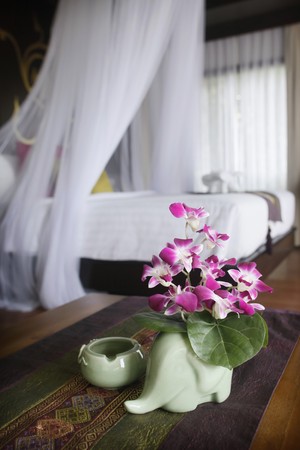 Flower arranged in a vase with the shape of an elephantの写真素材