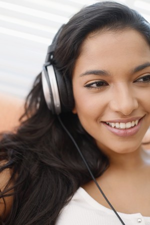 Woman listening to music on the headphonesの写真素材