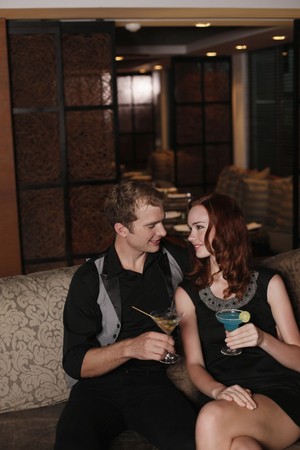 Man and woman smiling while looking at each other