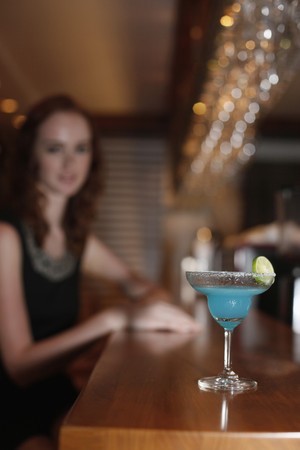 Glass of cocktail on the barの写真素材