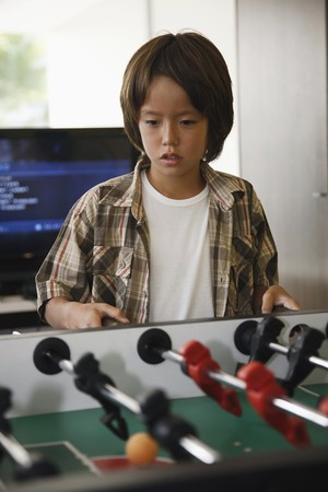  Boy playing table footballの写真素材