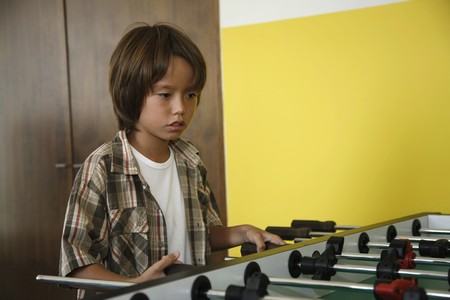  Boy playing table footballの写真素材
