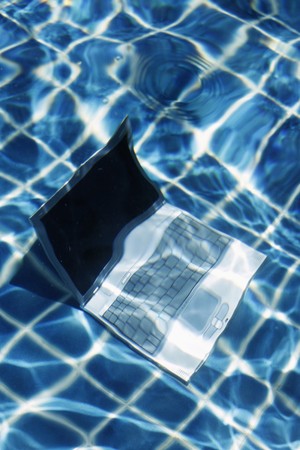 Laptop underwaterの写真素材