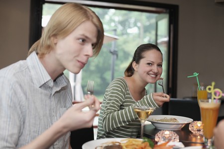 Man and woman eating の写真素材