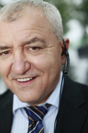 Businessman with telephone headsetの写真素材