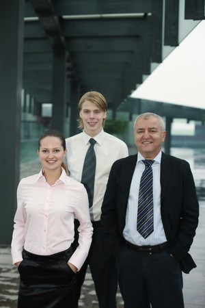 Business people with their hands in the pocketsの写真素材