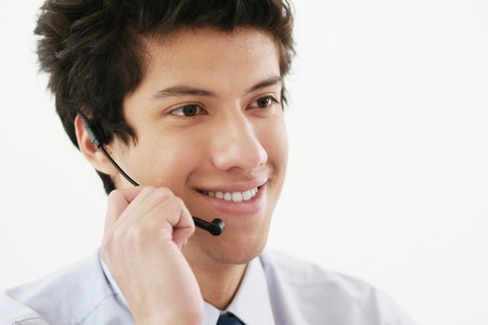 Businessman talking on headsetの写真素材