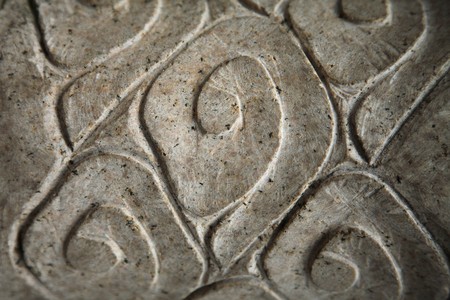 Close-up of pattern carved on stoneの写真素材