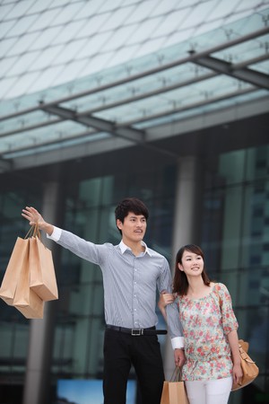 Man and woman hailing a cabの写真素材