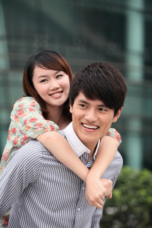 Woman with hands around man's neckの写真素材