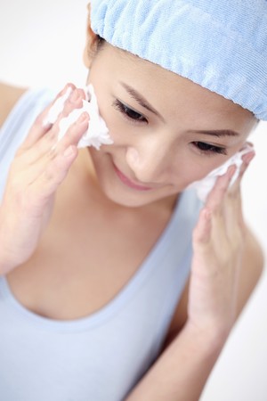 Woman cleansing her faceの写真素材