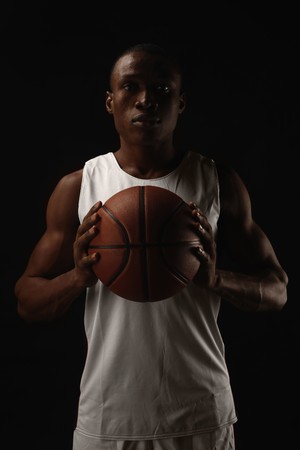  Man holding basketballの写真素材