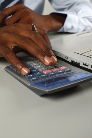 Businessman using calculatorの写真素材