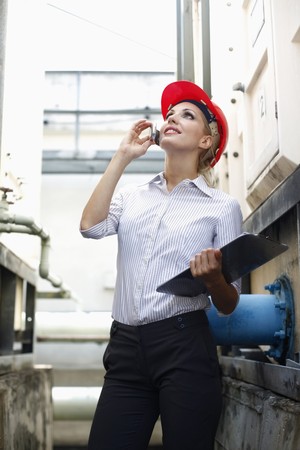 Female architect talking on the phone