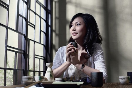 Woman holding a cup of teaの写真素材