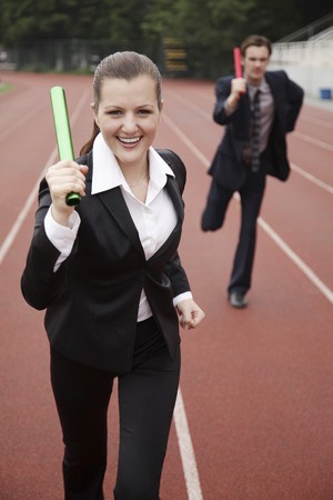 Business people running in a relayの写真素材