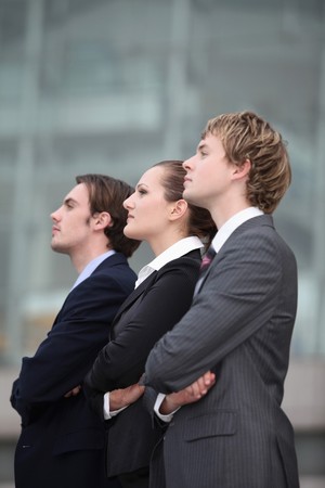 Business people standing with arms crossedの写真素材