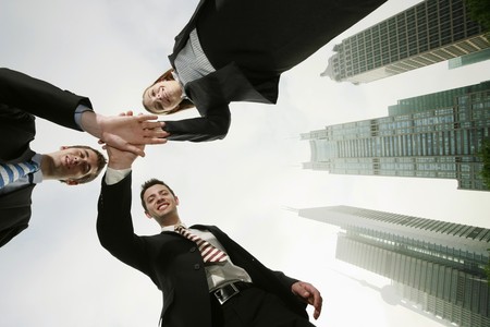Business people with hands together