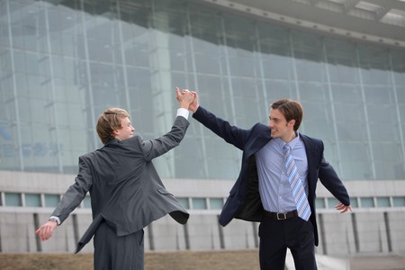 Businessmen clasping handsの写真素材
