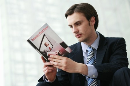 Businessman reading a bookの写真素材