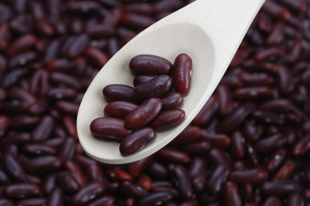 Kidney beans on wooden spoon