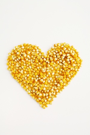 Heart shape made with corn kernelsの写真素材