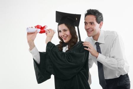 Graduate and man looking through a scrollの写真素材