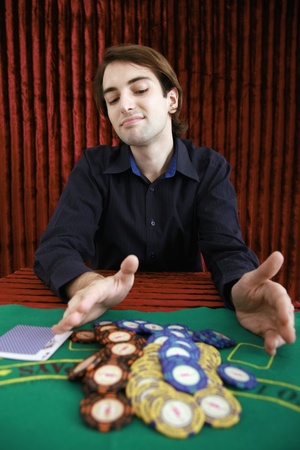 Man placing bets on gaming tableのeditorial素材
