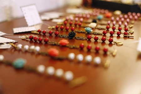 Beaded jewelry for sale in a retail storeの写真素材